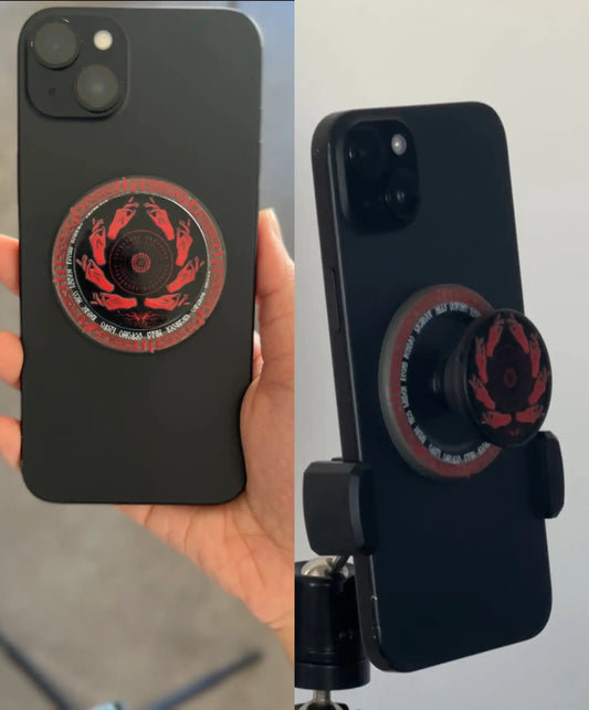Black phone with TØP Breach design phone grip hold by hand and a grip